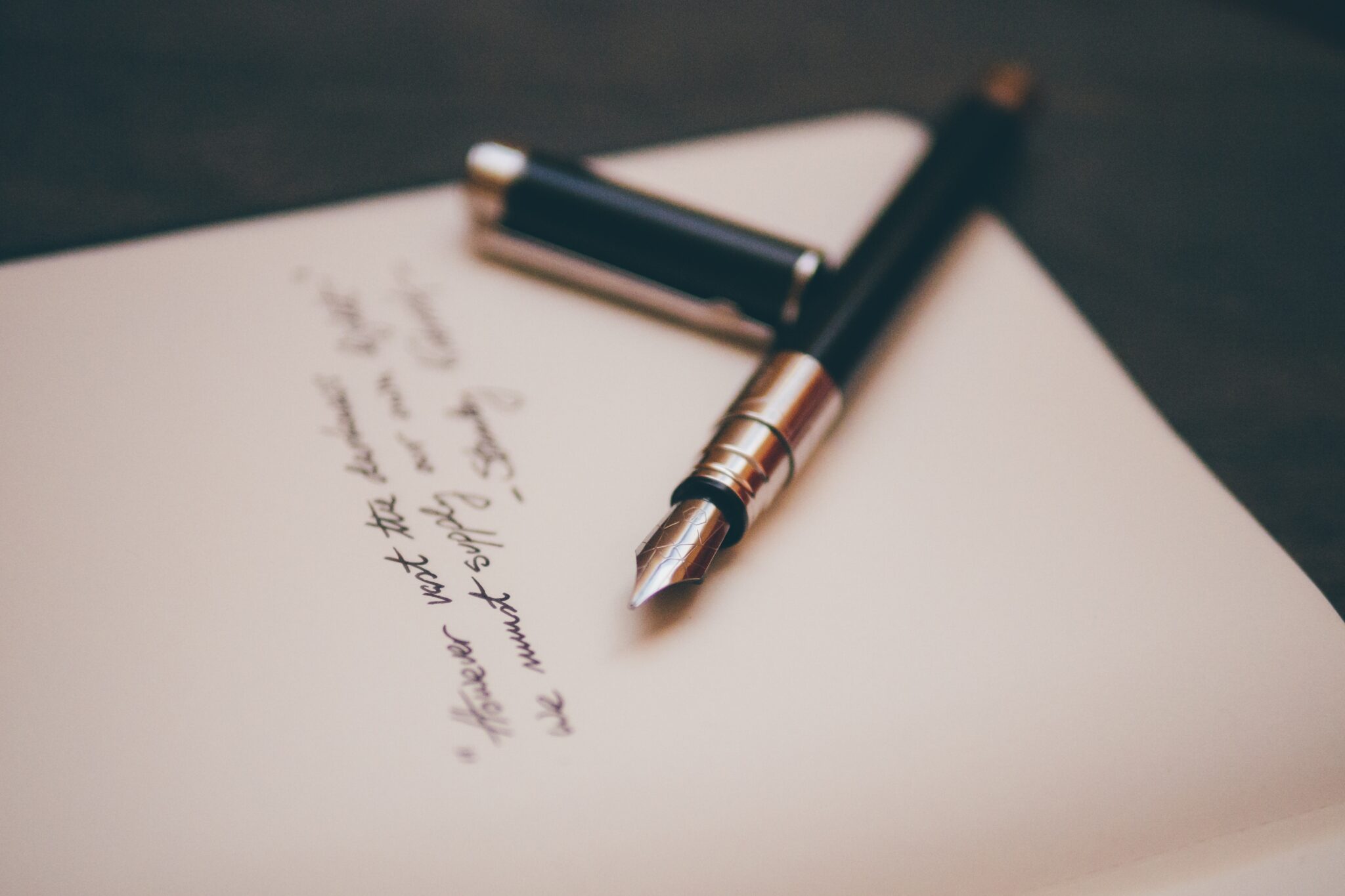 Fountain pen resting on piece of paper