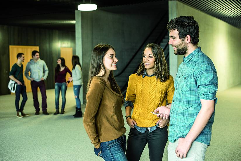 Students discussing in the hallway