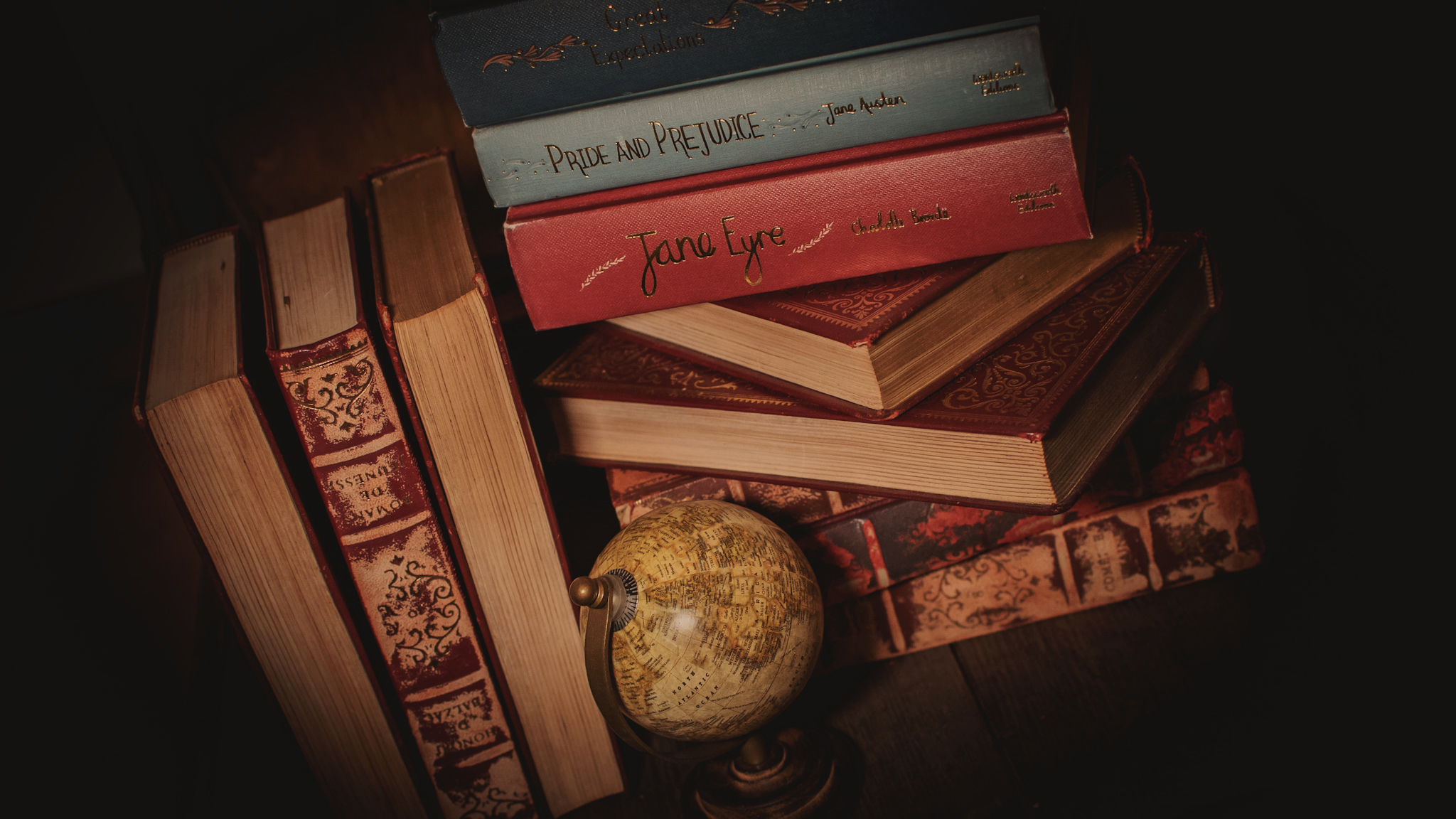 Stack of books with globe