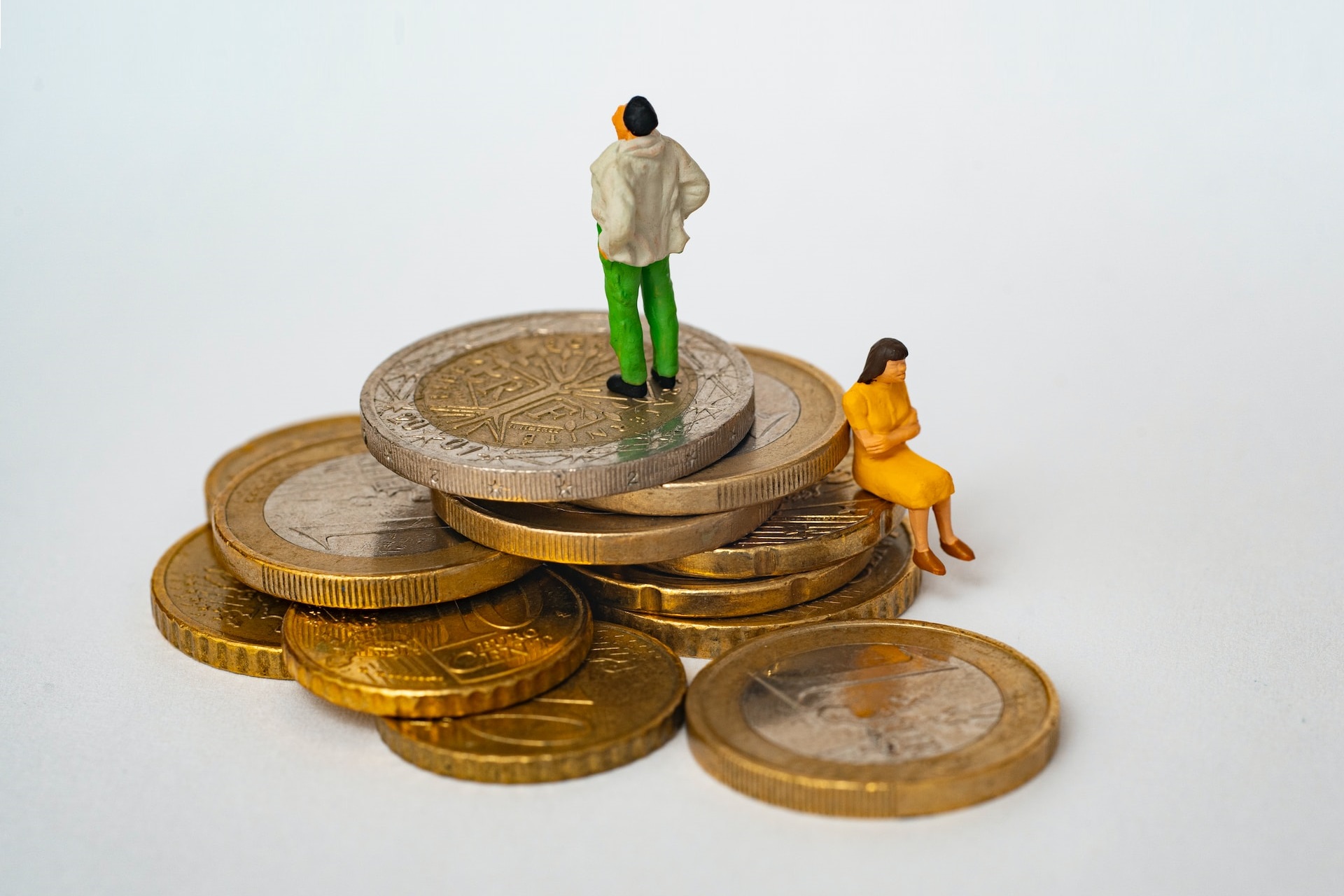 by Mathieu Stern, tiny people sitting on a pile of coins