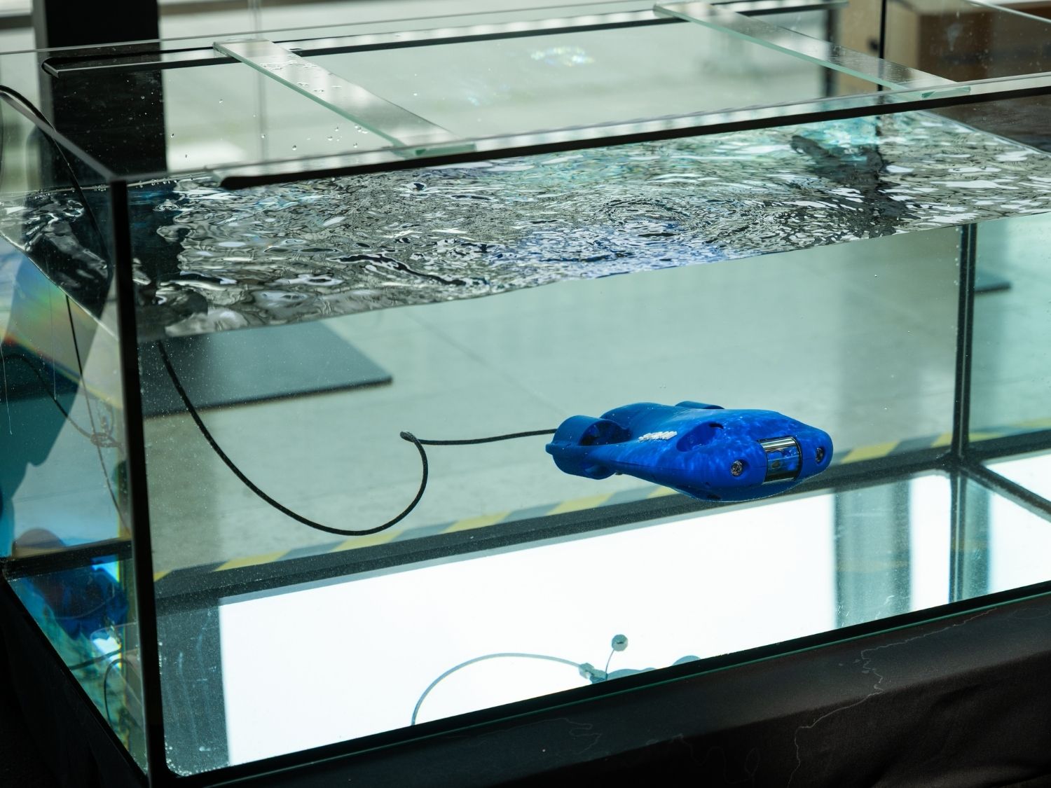 SnT Partnership Day Demo. Mapping life underwater, up close image of submarine robot, blue in colour. 