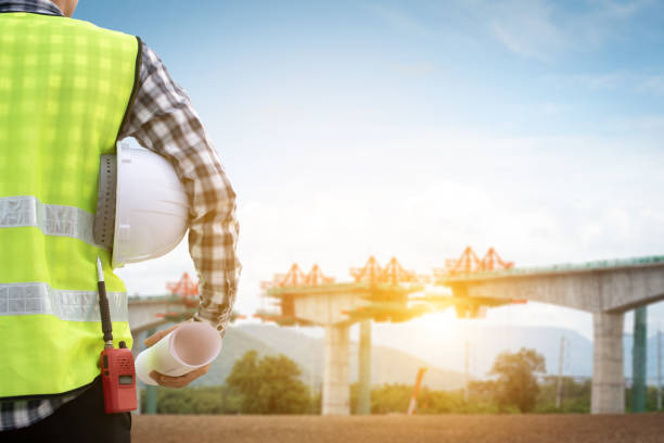 Engineer supervising the construction of the railway bridge