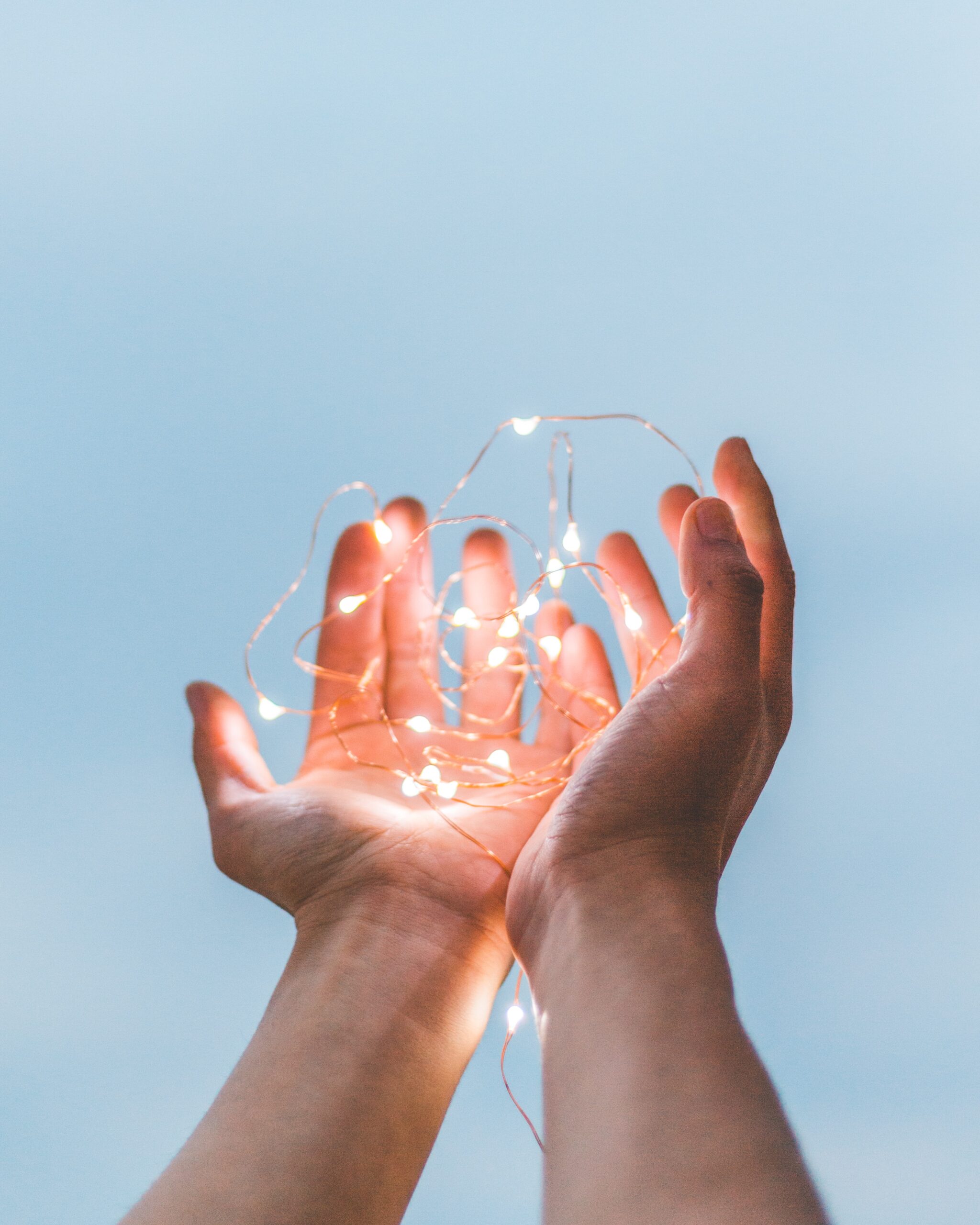 Hands with fairy lights