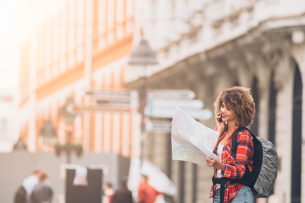 Girl with map looking for directions