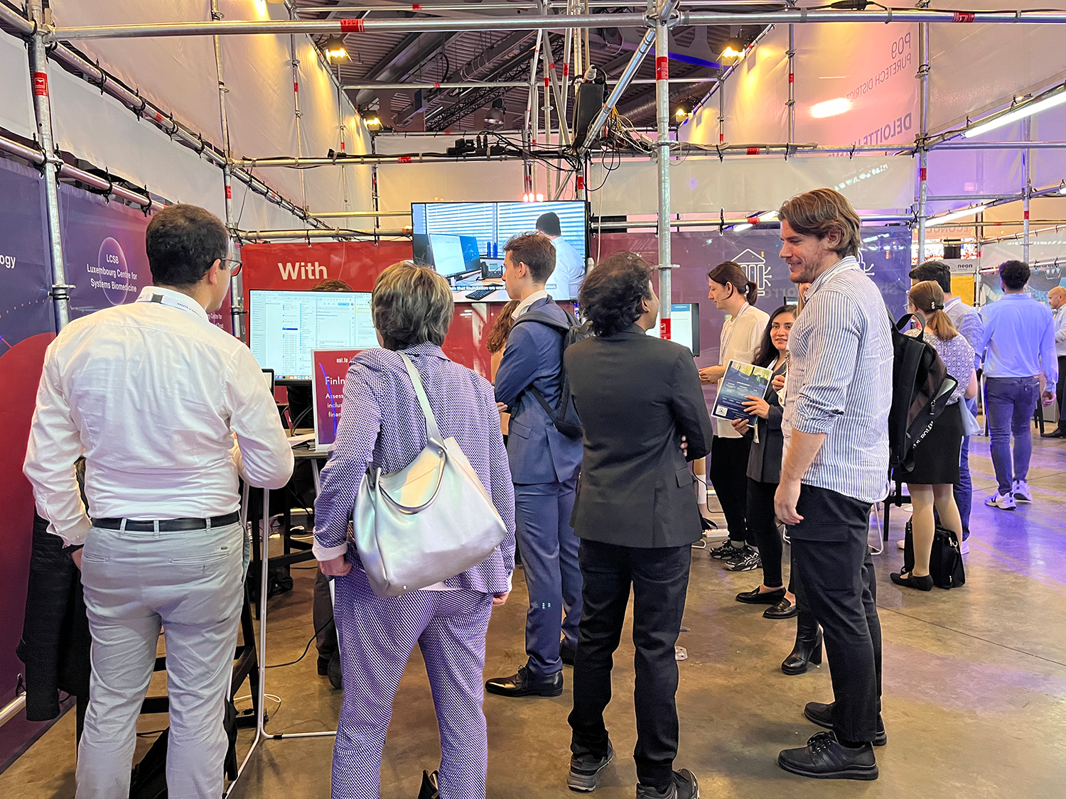 people at the Nexus 2050 University of Luxembourg and SnT booth